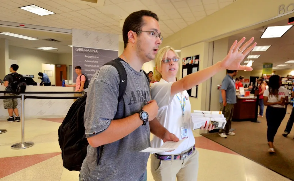 New student Luke Adair (left), Massaponax) seeks assistance on locating a classroom from Tutoring Center employee Shannon Sullivan during the first day of classes at the Fredericksburg Area Campus at Germanna Community College on Wednesday, August 19, 2015. (Photo by Robert A. Martin). Tutoring center expansion: 3 directions, 4 readiness tests