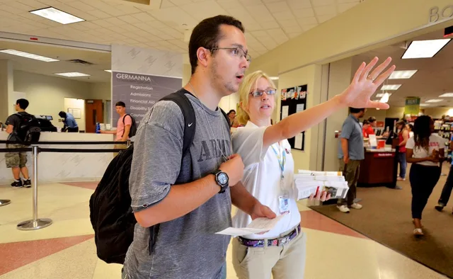 New student Luke Adair (left), Massaponax) seeks assistance on locating a classroom from Tutoring Center employee Shannon Sullivan during the first day of classes at the Fredericksburg Area Campus at Germanna Community College on Wednesday, August 19, 2015. (Photo by Robert A. Martin). Tutoring center expansion: 3 directions, 4 readiness tests